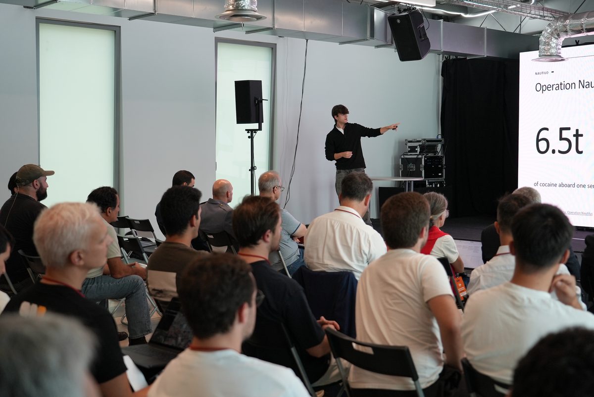 Robert pitching Nautilo solo to a full room at the EUDIS Defence Hackathon, Portugal